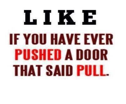 Pushing a door that says pull